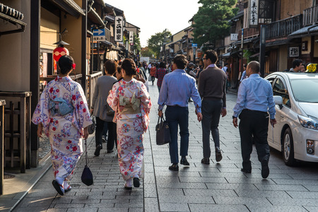 Kyoto, Japan - October 22, 2015: Three women in traditional Kimono clothing in the Gion District.のeditorial素材