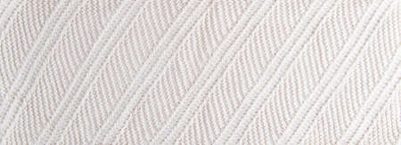 Knitted fabric with a pattern of white threads