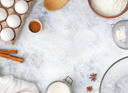 Layout on the table with ingredients and tools for baking and copy space in the center, Step 1/9