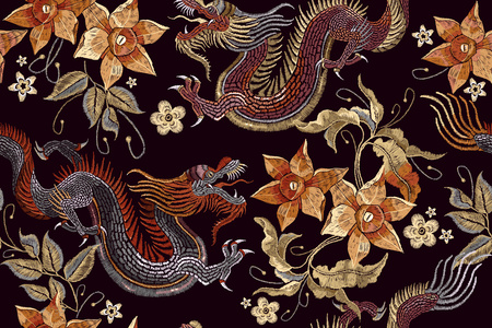 Embroidery dragons and flowers seamless pattern. Classical embroidery Asian dragon and beautiful vintage flowers seamless pattern. China dragons vectorのイラスト素材