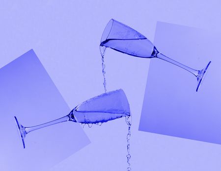 water pouring from 2 glassesの写真素材