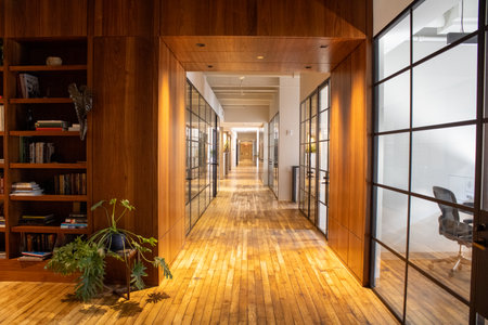 Interior of a modern office building with wooden walls and wooden floorのeditorial素材