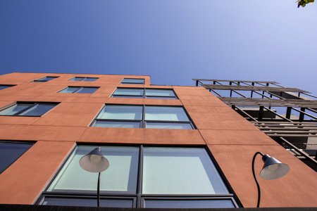 Modern apartment buildings on a sunny day with a blue sky. Facade of a modern apartment building.
