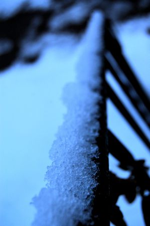 Snow on railingの写真素材