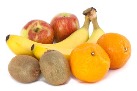 A selection of arrange fruit with apples oranges bananas and kiwi fruit on whiteの写真素材
