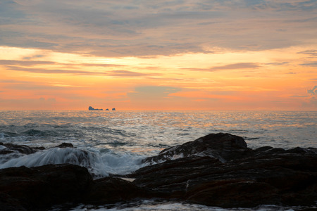 Sunset sea and big rocks at Koh Lanta island, Thailandの写真素材