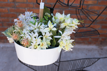 White flowers mixed in basketの写真素材