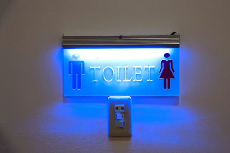 Toilet sign with lighting and switch on/off.の写真素材