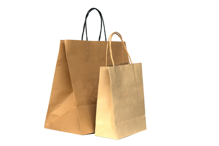 Recycled brown paper shopping bags isolated on white backgroundの写真素材