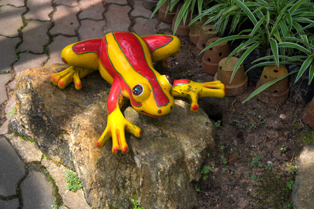 Decorative ceramic frog in gardenの写真素材