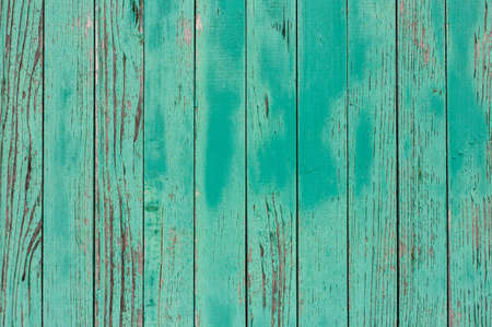 Old and weathered wooden green background with copy space. Cyan wooden background  with empty space for your text.  green wooden fence (palisade) - Vintage style. Striped surface with aqua color.の写真素材