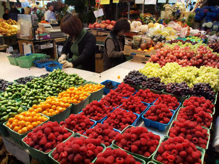 Fruit and veg stand at Granville Market Vancouver in British Columbia Canadaのeditorial素材