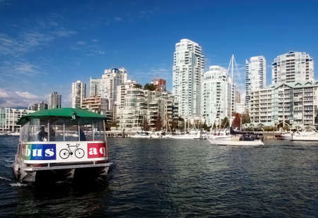 Aquabus coming in to dock at Granville island in Vancouverのeditorial素材