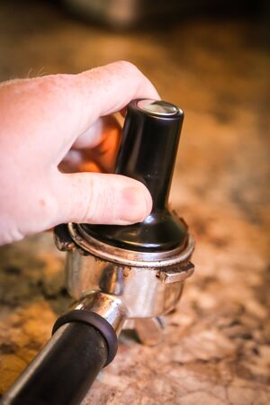 Coffee, or espresso making process - grinding and extracting coffee beansの写真素材