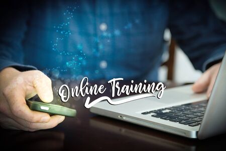 Online training distance learning concept - laptop and cellphone.の写真素材