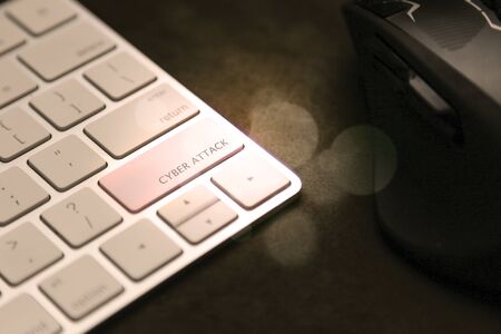 Cyber attack key on keyboard. Mouse in background, computer securityの写真素材
