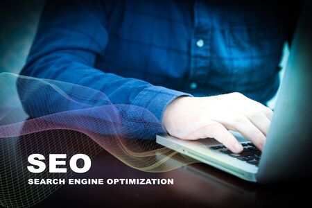 seo analysis concept typing man on computerの写真素材