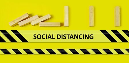 Social Distancing concept - bricks spaced apart so they don't fall showing social distancingの写真素材