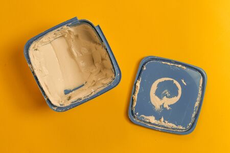 filler - wood filler or crack filler over yellow backgroundの写真素材
