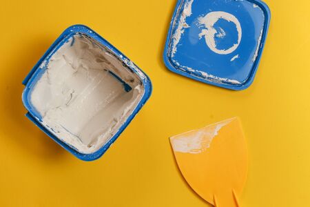 drywall repair filler or crack filler over yellow background