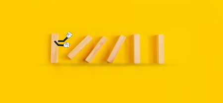 Falling Dominoes, domino pushing the others - idea of bullying.