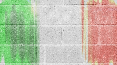 Italian flag on wall of bricksの写真素材
