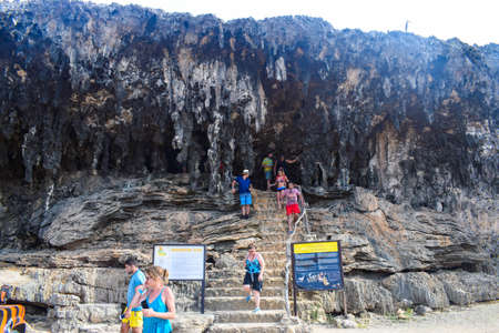 Arikok Natural Park on the island of Aruba in the Caribbean Sea with deserts and ocean waves on the rocky coastのeditorial素材