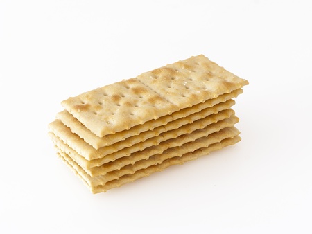 a stack of crackers on white background