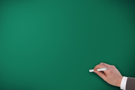 hand writing on empty green chalk boardの写真素材