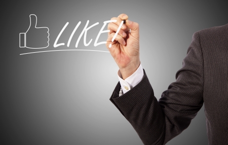 businessman write like on presentation glass, grey backgroundの写真素材