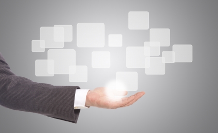 business man with hand pushing on a touch screen interfaceの写真素材