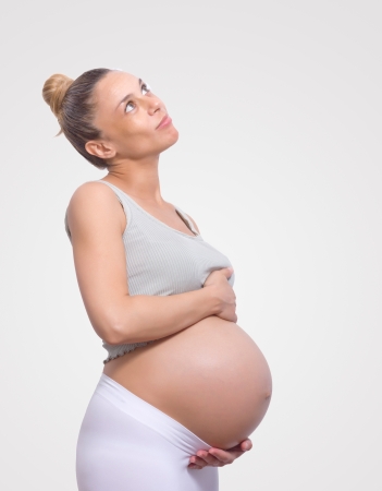 pregnant woman holding her belly very bigの写真素材