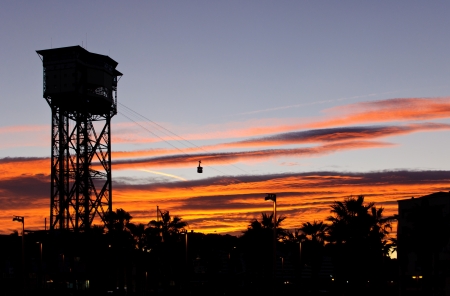 Silhouette of a cable car in the old port at sunset の写真素材