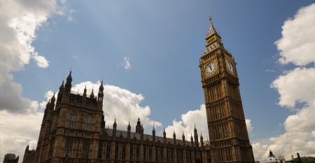 Big Ben enlightened by a sunray in a cloudy day  London, England 