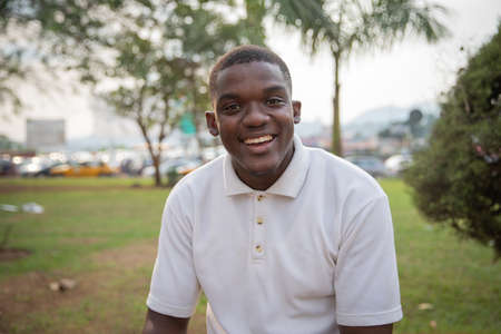 Portrait of a smiling attractive young african boy outdoorsの写真素材