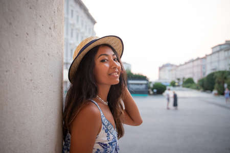Portrait of a happy Asian tourist during her vacation in Italy, smiling womanの写真素材