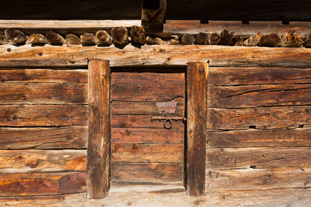 Alpine hut with aged planks of larch woodの写真素材