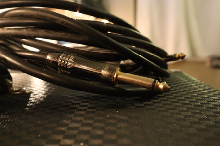 Close-up of a used guitar cable and jackの写真素材