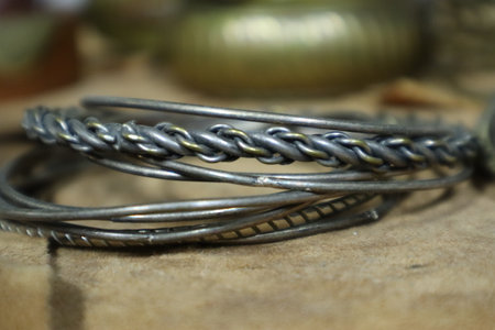 Close up of some vintage metal braceletsの写真素材