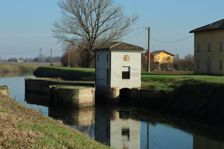 Ancient dock along the river seen from the frontの写真素材