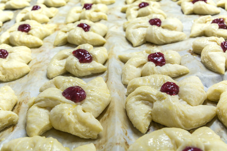 precooking,petal shape pie with red berry jams center dropの写真素材