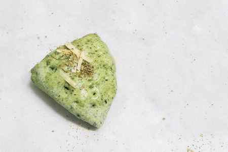 spinach bread with cheese on stencil paper, dressing with spiceの写真素材