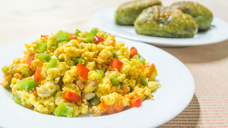 To eat eggs every morning with mixed vegetable scramble egg and spinach breadの写真素材