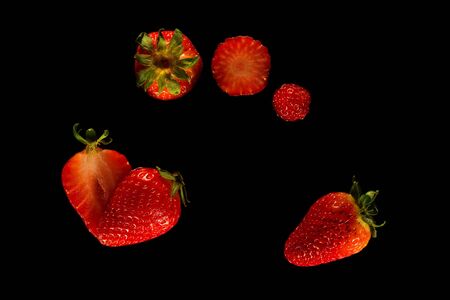Strawbarries sequence on black backgroundの写真素材