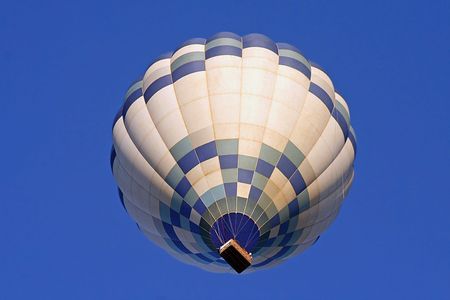 A Hot Air Balloon on an clear morning flight viewed from below.の写真素材