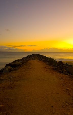 A beautiful sunrise and breakwater at Noosa Beach, Sunshine Coast, Queensland, Australiaの写真素材