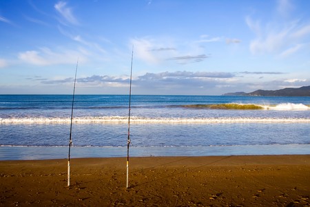 Surfcasting rods in the sand at Taipa Beach on a beautiful summers evening, Northland, New Zealand,の写真素材