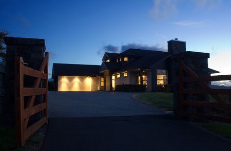 A modern house exterior at nightの写真素材