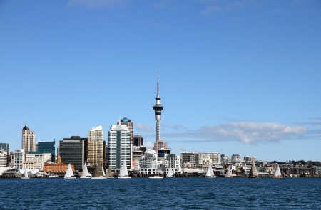 Yachts racing past Auckland City and Skytower on a clear sunny day, New Zealand の写真素材