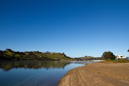 Taipa Estuary at high tide on a still morning with clear blue skies, Doubtless Bay, Northland, New Zealandの写真素材